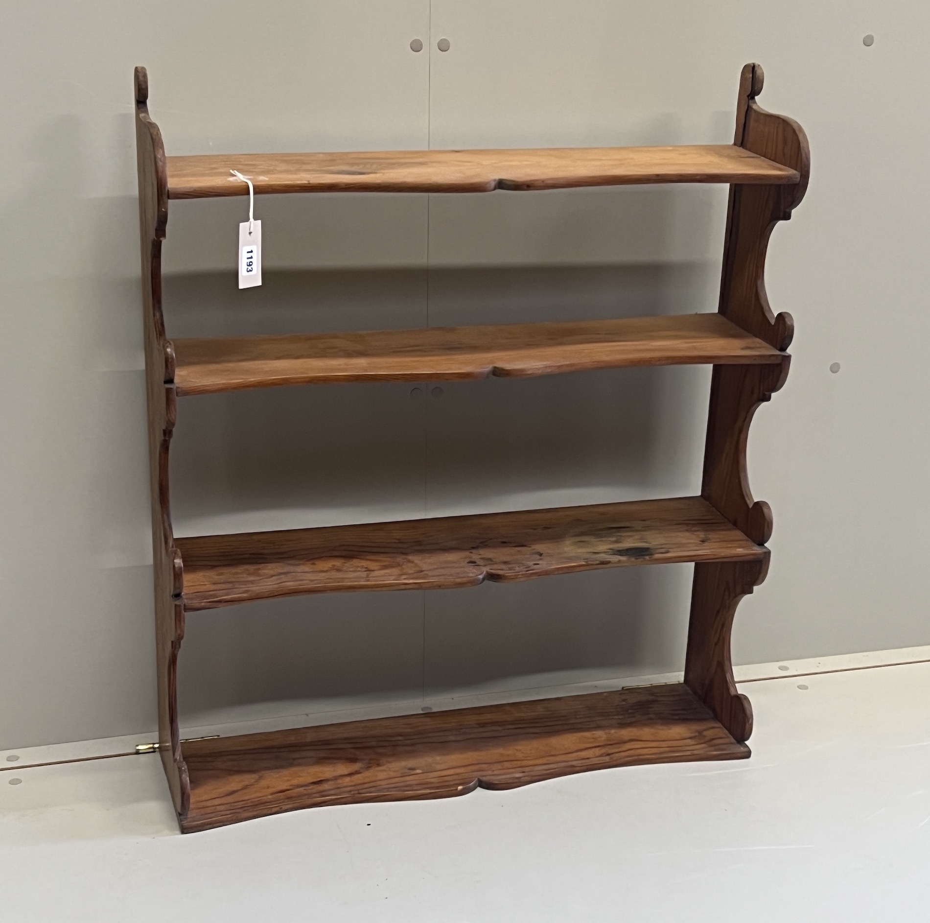A Victorian pitch pine four tier wall bracket, width 75cm, depth 21cm, height 87cm